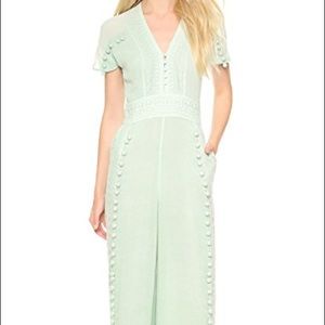 ISO Marchesa Voyage Paneled Pom Pom Jumpsuit
